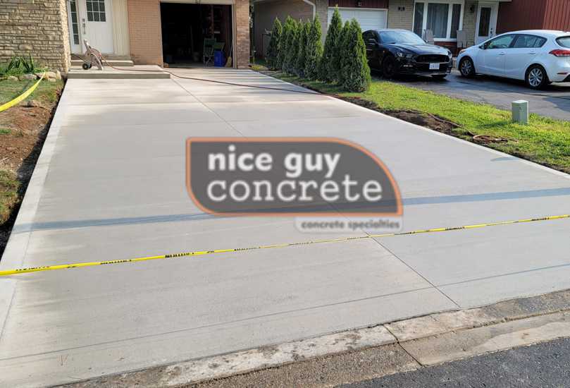 Smooth plain concrete driveway with broom finish