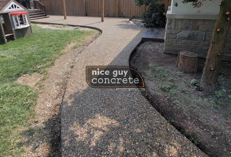 Charming Concrete Patio in Oakville with Creative Landscaping