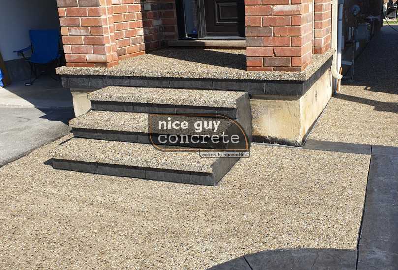 Elegant exposed aggregate concrete driveway enhancing curb appeal